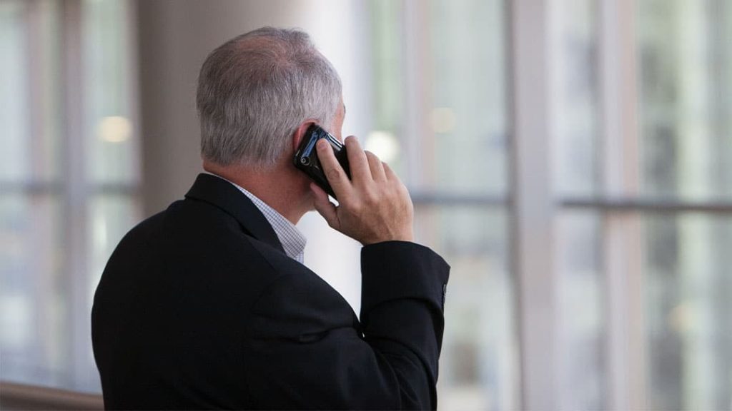 Business man receiving a telemarketing call