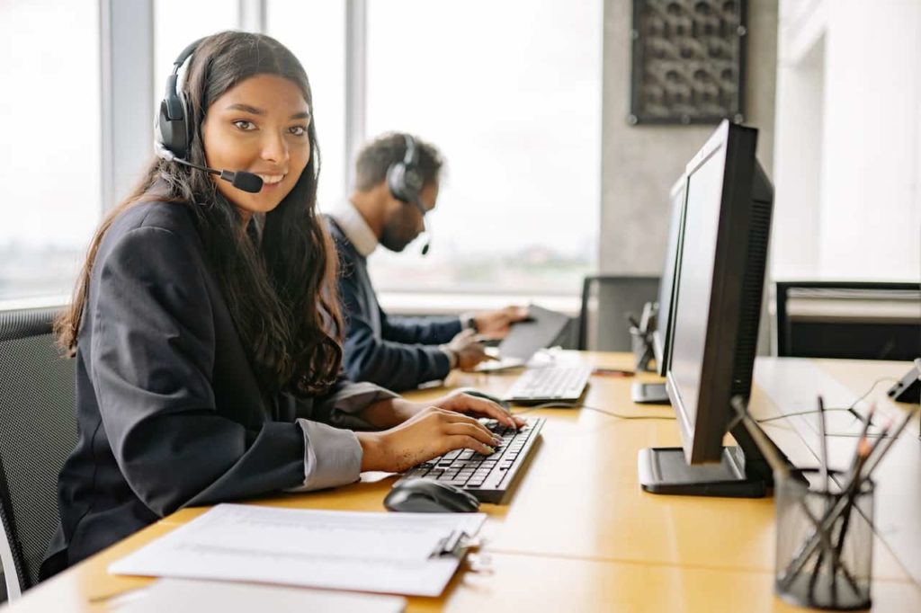 Smiling Woman Working in a Call Center